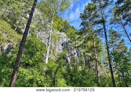 Tavda caves (tavdinskiye peshchery) - karst mountain massif with an extensive chain of caves landmark of Altai mountains Russia Siberia