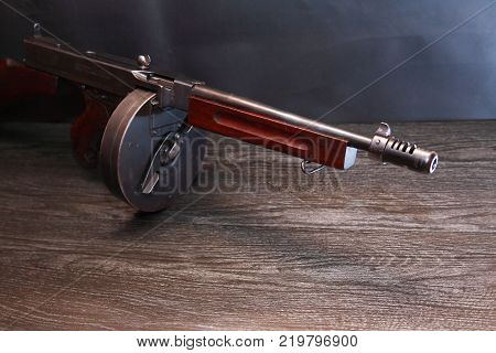 Old USA submachine gun closeup on dark background