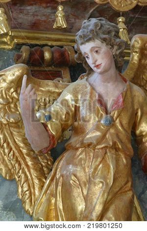 BELEC, CROATIA - NOVEMBER 17: Angel statue on the altar in the Baroque Church of Our Lady of the Snow in Belec, Croatia on November 17, 2011.