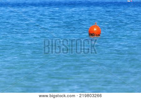 Buoy at right side on blue ocean like mergency sign for sailing boat
