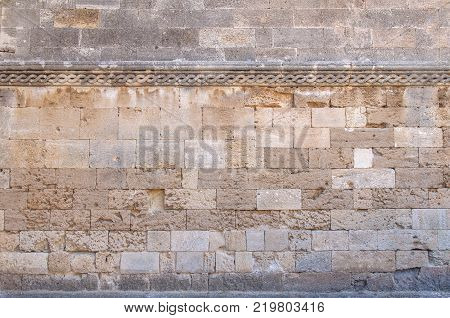 Castle decorative pattern with yellow rugh stone block from ancient structure texture