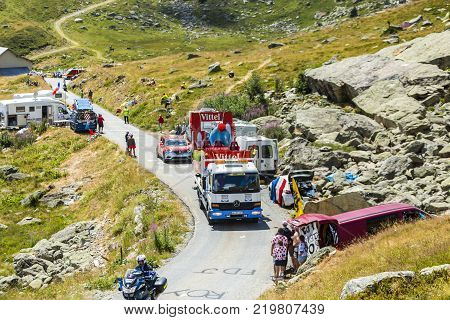 Col de la Croix de Fer France - 25 July 2015: The service truck transports a broken Vittel vehicle on the road to the Col de la Croix de Fer in Alps during the stage 20 of Le Tour de France 2015.