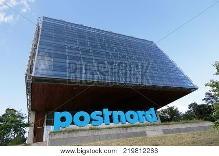 Solna Sweden - June 27 2016: The exterior of the Swedish postal service Postnord modern head office building located in Tomteboda.