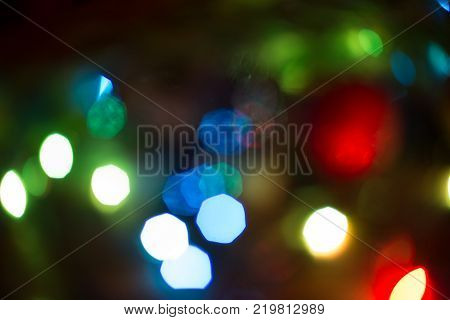 Color Blurred background: Bokeh lighting in accord with the audience, the texture of the copy space point, entertaining concert lighting on stage, a blurred disco.