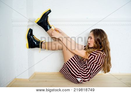A portrait of a teen girl model in a stdio