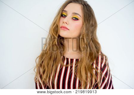 A portrait of a teen girl model in a stdio