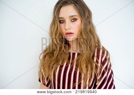 A portrait of a teen girl model in a stdio