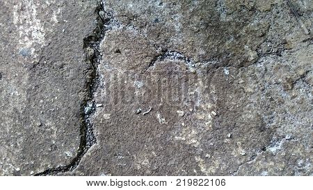 Old vintage cement messy cracked wall, grunge brick textured background, panoramic photo