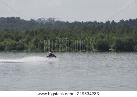guy cruising on the atlantic ocean on a jet ski
