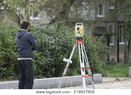 a worker stands next to the level