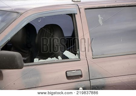 shattered glass Broken side window in a car.