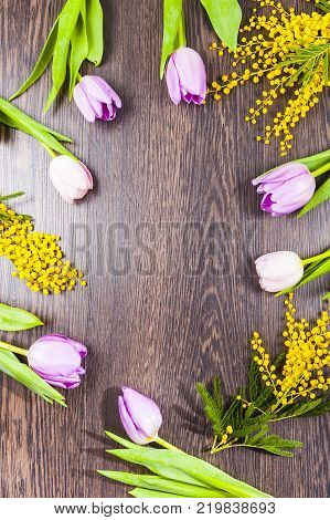 Mimosa And Paper On A Wooden Background