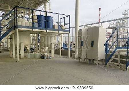 Tool box and a playground pouring chemical. The equipment for oil refinery.