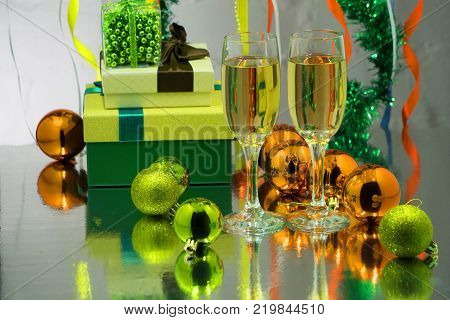 Christmas decorations whit champagne glass on purple background