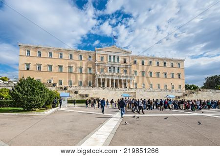 Athens Greece - November 1 2017: Tourists in front of the building of Greek parliament in Athens Greece.