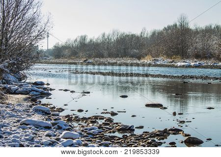 River in Winter. Rapids of Stormy River. Winter Landscape