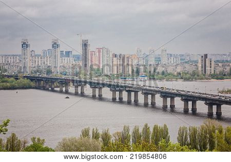 Aerial top view of Paton bridge and Dnieper river from above, city of Kiev, Ukraine