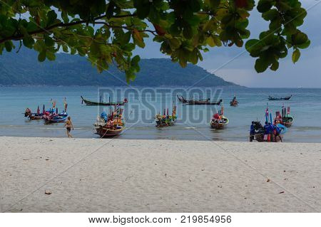 RAWAI BEACH, PHUKET ISLAND, THAILAND - FEBRUARY 28, 2016: long tailed boat at exotic Bay of Rawai in Phuket island Thailand