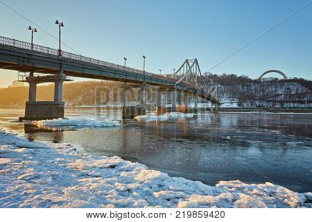 Evening view to Pedestrian bridge and Arc of a friendship of a nations in Kiev