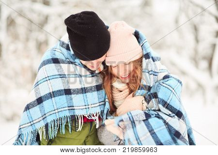 Panoramic landscape in the park with blue checkered plaid. Must be warm.