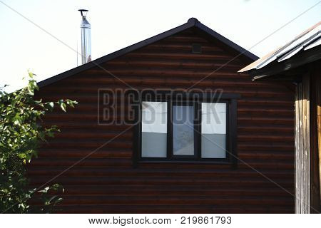 Wooden housing construction felling from a round log