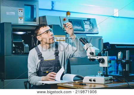 quality control part metal worker machine male