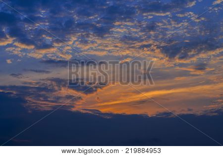 dramatic sky of sunset in the evening behind rain