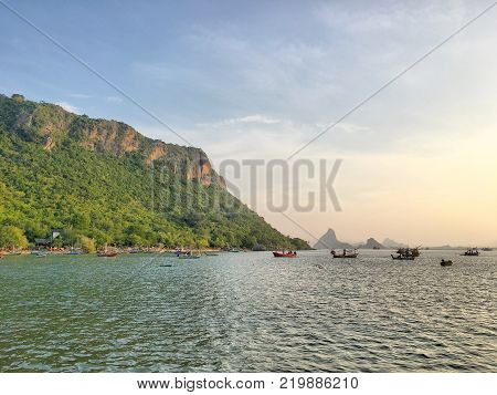 Many ships on the seawaves inthe twilight time in Thailand sea.