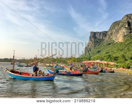 Many ships on the seawaves inthe twilight time in Thailand sea.