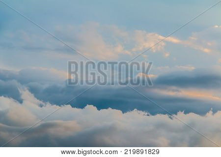 Beautiful cloudscape with blue and gray contrasting clouds during thunderstorm