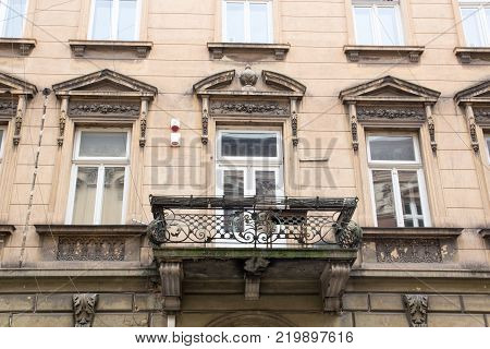 Facade of the old vintage house with a balcony