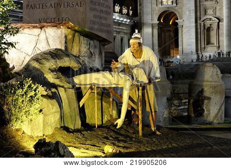 VATICAN CITY VATICAN STATE - DECEMBER 14 2017: detail of the statues in the Vatican crib a corpse being put in a hole in the rock