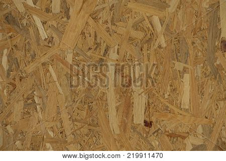 Texture of OSB with the individual strips lying unevenly across each other