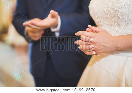 Wedding couple bide and groom get married in a church.