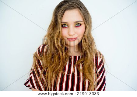 A portrait of a teen girl model in a stdio