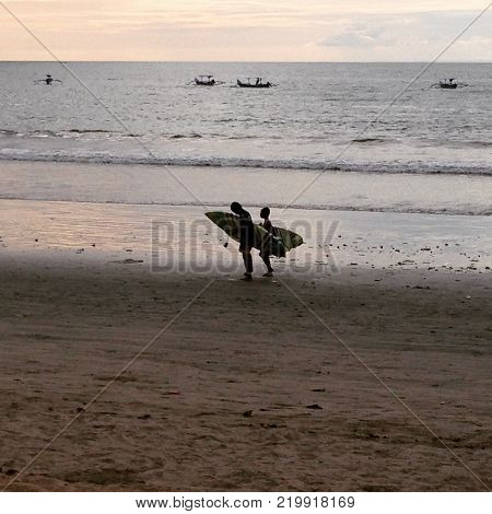 to the house
after learning to surf with relatives on the coast of Bal