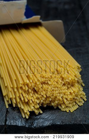 Spaghetti noodle on dark rustic wood picture