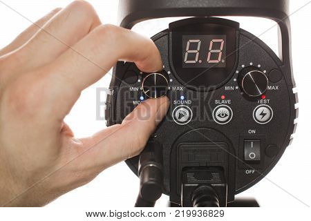 hand holding a flash, isolated on a white background adjustable with a finger