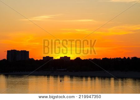Orange Sunset Over A River Dnieper In Kremenchug City, Ukraine