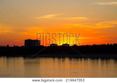 Orange Sunset Over A River Dnieper In Kremenchug City, Ukraine