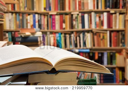 Old open book with a library background