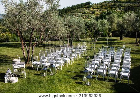 Outdoor wedding ceremony around the green mountains. Villa Bordoni