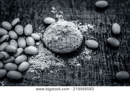 Close Up Of Ayurvedic Herb Kuanch,cowhage,mucuna Pruriens With Powder.