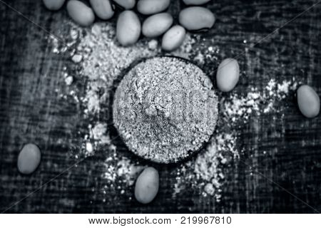 Close Up Of Ayurvedic Herb Kuanch,cowhage,mucuna Pruriens With Powder.