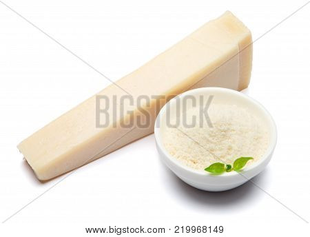 a piece of Parmesan cheese on white background with grated in ceranic bowl