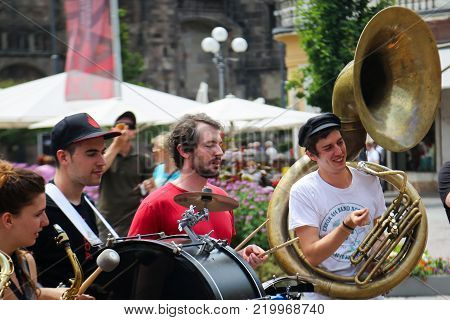 A street music band playing at Walther square in Bolzano, Italy, 29th of June 2015