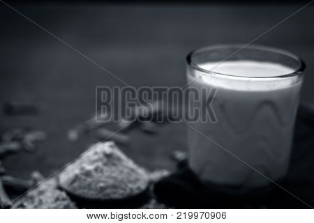 Close Up Of Ayurvedic Herb   Satavari,asparagus Racemosus With Its Powder And Root With Milk Glass.