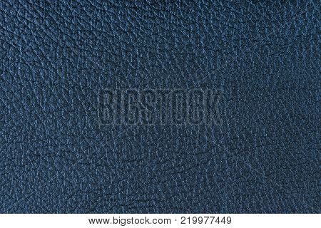 Texture of artificial leather. Blue background or leatherette backdrop.