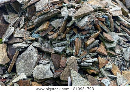 heap of rubbish from broken tiles and stones
