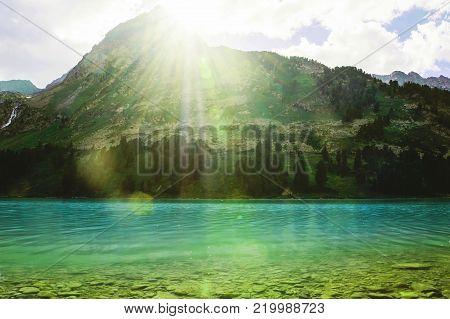 Bright Sunlight Shines From Behind The Mountain.